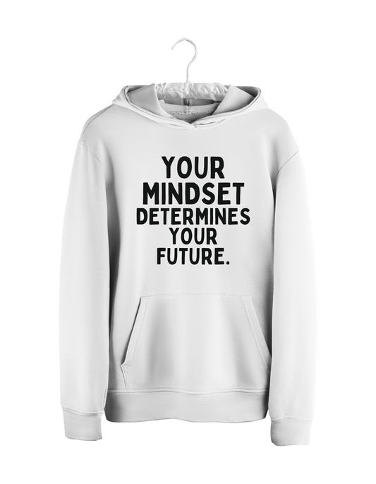 Witte unisex hoodie met zwarte tekst "Your mindset determines your future", opgehangen aan kapstok – motiverende streetwear van jvrmonkeydesign.